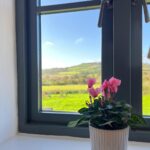 View out the window to rolling green hills